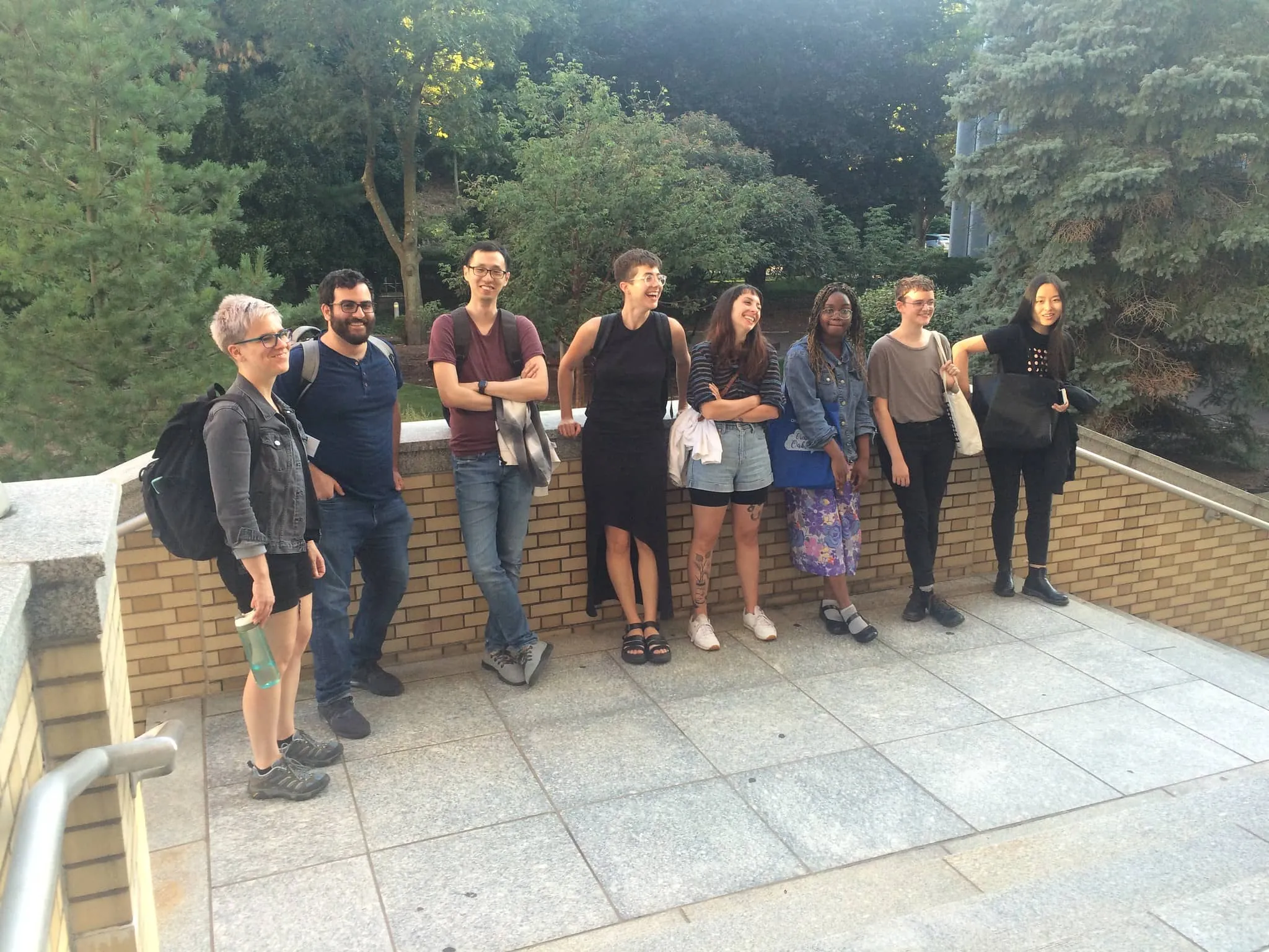 Participants standing outside smiling